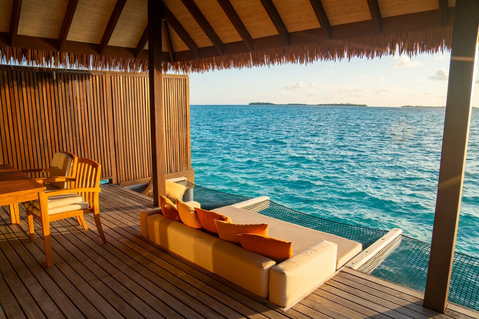 Sunset views from overwater pool villa in Maldives