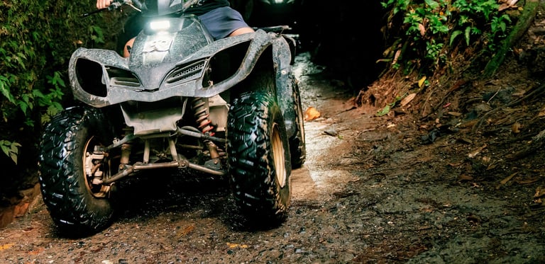 Off road adventure with ATV on muddy trail