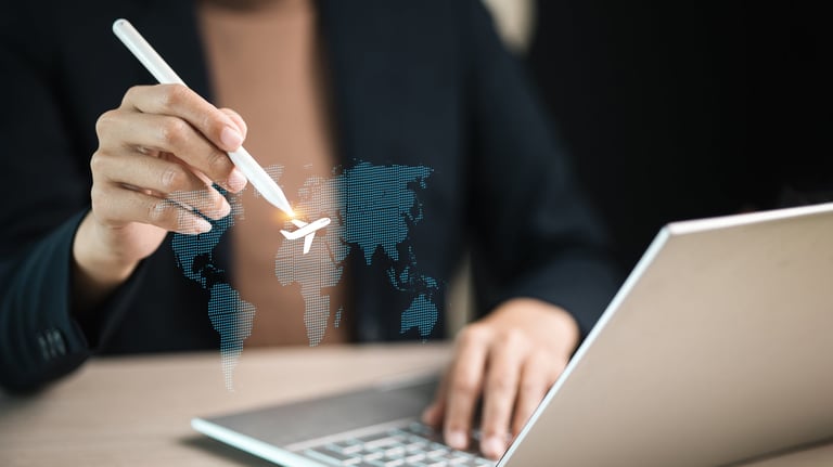 Businessperson using stylus to select airplane icon on virtual world map